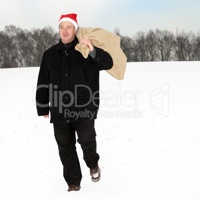 Man with cloth bag runs through the snow