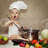 little baby in a chef's hat and ladle in hand