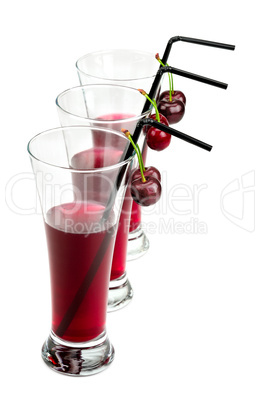 glasses of cherry juice isolated on white background