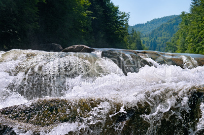 waterfall on the river in the mountains