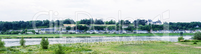 Panoramic view of medieval village over Loire river, France