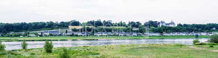 Panoramic view of medieval village over Loire river, France