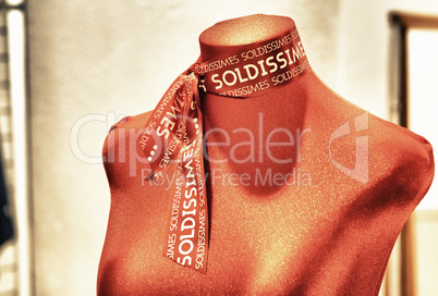 Manikin with red scarf. Sale abstract concept