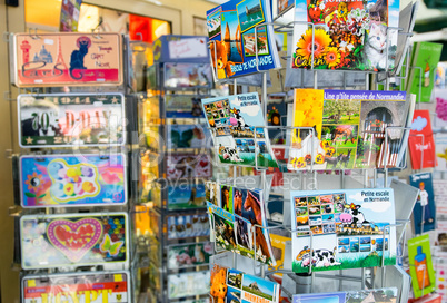 ETRETAT, FRANCE - JULY 10, 2014: Postcards on a street shop. Etr