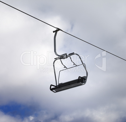 Chair-lift and cloudy sky