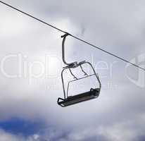 Chair-lift and cloudy sky