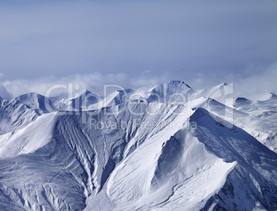 Snowy mountains in mist