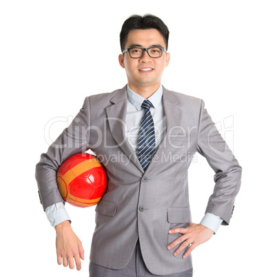 Asian businessman with soccer ball