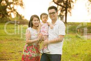 Asian family at outdoor garden park