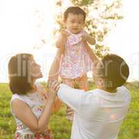 Asian family playing at outdoor