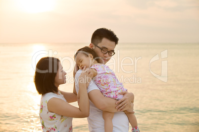 Asian family vacation at beach