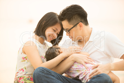 Asian family at outdoor sand beach