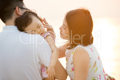 Young Asian family at outdoor beach