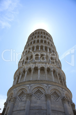 Leaning tower of pisa with sun rays halo