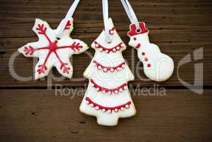 Christmas Cookies Hanging on Wood Closeup