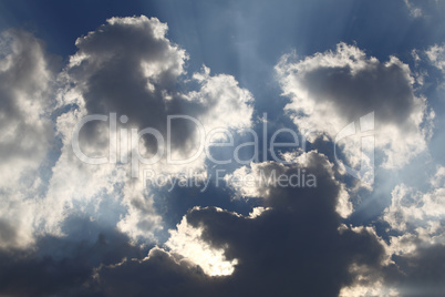 Sun rays through storm clouds