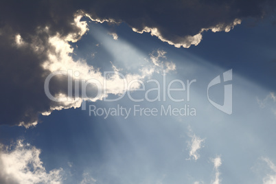 Sun rays through storm clouds