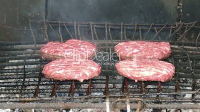 Hamburgers Cutlets Grilling on Grid, closeup