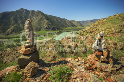 Pyramid of stones on a background of mountains