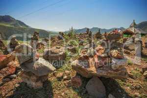 Pyramid of stones on a background of mountains