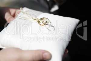 wedding rings on pillow