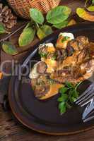 Steak with potato dumplings and forest mushroom sauce