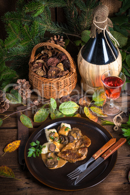 Steak with potato dumplings and forest mushroom sauce