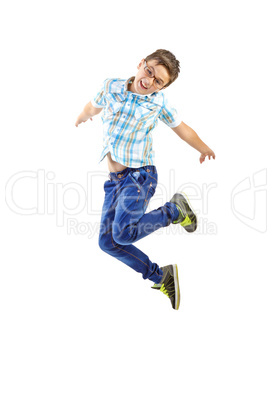 Little boy jumping on white background