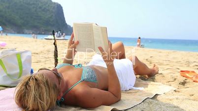 blonde women reading a book