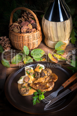 Steak with potato dumplings and forest mushroom sauce