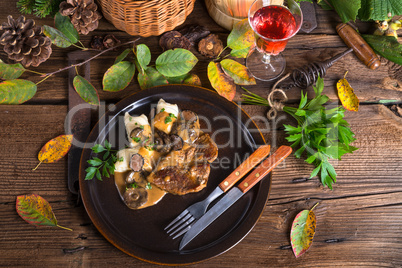 Steak with potato dumplings and forest mushroom sauce