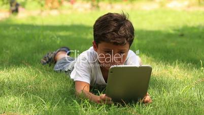 little cute kid using digital tablet