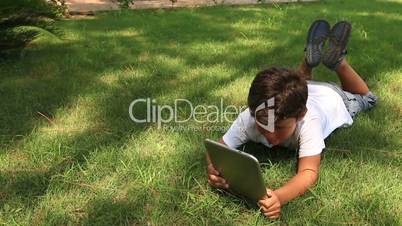 little cute kid using digital tablet