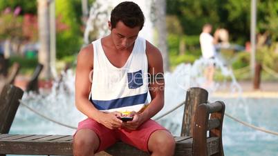 attractive young men using digital tablet