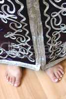 girl's feet in Moroccan suit