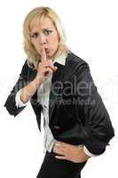 Business woman holding her finger near the mouth