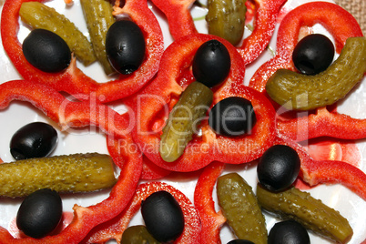 Black olives, marinaded cucumbers and paprika