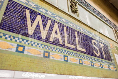 Wall Street subway station sign