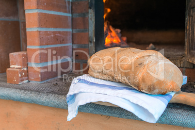 Bread in front of wood-fired oven