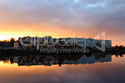 landscape with river and modern house reflecting in it