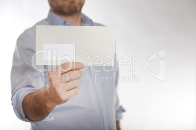 Man holds a letter into the camera