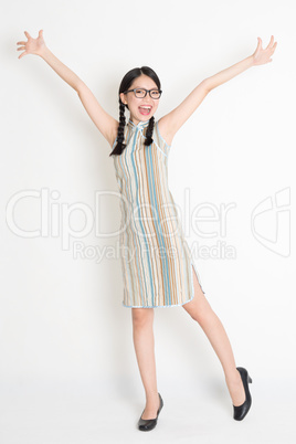 Asian Chinese girl arms outstretched