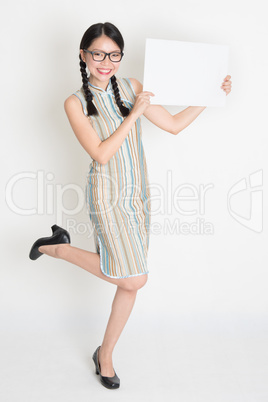 Asian Chinese female hands holding a blank white card