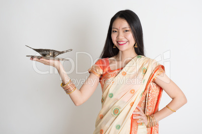 Indian housewife hand holding empty plate