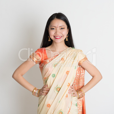 Confident Indian girl in sari smiling