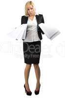 Desperate business lady with a pile of papers