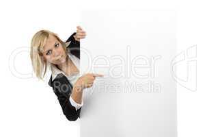 Businesswoman looking out of white billboard