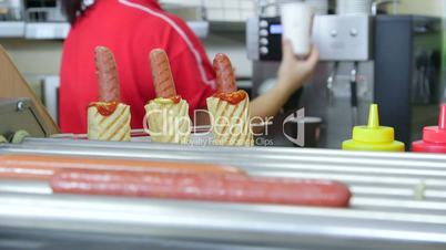 Order hot dog and a cup of drink at takeaway diner