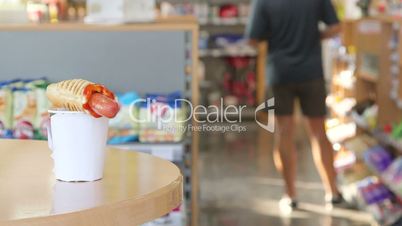 Order hot dog and coffee cup in convenient store