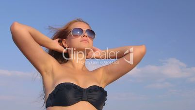 Young girl wearing sunglasses on the beach